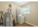 The laundry room with washer, dryer, and water heater at 40 N Villa Rd, Villa Rica, GA 30180