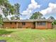 Expansive backyard with well-maintained lawn and brick exterior of the residence at 3 Ridge Dr, Hampton, GA 30228