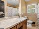Cozy bathroom with classic fixtures, floral accents, and a vanity providing storage at 3 Ridge Dr, Hampton, GA 30228