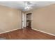 Bedroom featuring hardwood floors and closet with a wire rack shelving at 3 Ridge Dr, Hampton, GA 30228