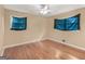 Bedroom featuring hardwood floors, neutral walls and two windows at 3 Ridge Dr, Hampton, GA 30228
