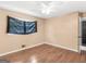 Bedroom featuring hardwood floors, neutral walls, and single window at 3 Ridge Dr, Hampton, GA 30228