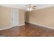 Neutral bedroom with hardwood floors and a ceiling fan; features a classic design at 3 Ridge Dr, Hampton, GA 30228