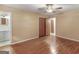 Bedroom featuring hardwood floors, ceiling fan, and connecting bathroom at 3 Ridge Dr, Hampton, GA 30228