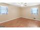 Bright bedroom features natural light, ceiling fan, and hardwood floors at 3 Ridge Dr, Hampton, GA 30228
