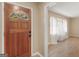 Inviting entrance with wood door opening into a bright, airy living space with hardwood floors at 3 Ridge Dr, Hampton, GA 30228