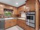 Kitchen featuring wood cabinets, modern stainless steel appliances, and durable countertops at 3 Ridge Dr, Hampton, GA 30228