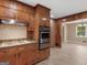 Kitchen featuring wood cabinets, modern stainless steel appliances, and durable countertops at 3 Ridge Dr, Hampton, GA 30228