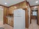 Spacious kitchen with ample wood cabinetry and adjacent doorway, plus an appliance at 3 Ridge Dr, Hampton, GA 30228