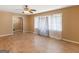 Bright living room with hardwood floors, neutral walls, curtains, and a ceiling fan at 3 Ridge Dr, Hampton, GA 30228