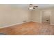 Neutral living room with hardwood floors, ceiling fan, and views to other rooms of the home at 3 Ridge Dr, Hampton, GA 30228