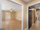 Open-concept living area featuring neutral walls, wood-look flooring, and an inviting view to dining and hall at 3 Ridge Dr, Hampton, GA 30228