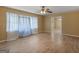 Bright living area with hardwood floors, ceiling fan, window coverings, and an open layout at 3 Ridge Dr, Hampton, GA 30228