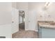 Bathroom features a granite-topped vanity, soaking tub, tile floor and large window at 3130 Lower Creek Dr, Douglasville, GA 30135