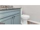 Bathroom featuring granite countertop and gray cabinet at 3130 Lower Creek Dr, Douglasville, GA 30135