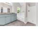 Bright bathroom with a granite-topped double vanity, soaking tub, and separate shower at 3130 Lower Creek Dr, Douglasville, GA 30135