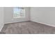 Bright bedroom with neutral carpet and a large window at 3130 Lower Creek Dr, Douglasville, GA 30135