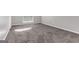 Well-lit bedroom with neutral carpet and a large window at 3130 Lower Creek Dr, Douglasville, GA 30135