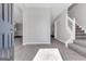 Inviting foyer with tile flooring, a staircase with white banister, and natural light at 3130 Lower Creek Dr, Douglasville, GA 30135