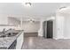 Well-lit kitchen showcases stone countertops and open layout at 3130 Lower Creek Dr, Douglasville, GA 30135
