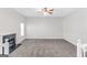 Spacious living room with fireplace, tall ceilings, and neutral carpeting at 3130 Lower Creek Dr, Douglasville, GA 30135