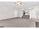 Open-concept living room with a ceiling fan and view of the kitchen at 3130 Lower Creek Dr, Douglasville, GA 30135