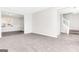 Spacious living room with neutral carpet, light walls, and a view of the staircase at 3130 Lower Creek Dr, Douglasville, GA 30135