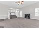 Spacious living room with fireplace open to a modern kitchen at 3130 Lower Creek Dr, Douglasville, GA 30135