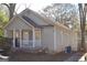 A cozy home with a covered porch and a well-kept yard, blending comfort and charm at 1267 Lyle Nw Pl, Atlanta, GA 30318