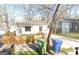 Cozy home featuring a fenced yard, a driveway, and front porch in a neighborhood at 1267 Lyle Nw Pl, Atlanta, GA 30318