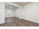 An empty bedroom featuring hardwood floors, natural light, and neutral colors at 244 Oliver Dr, Locust Grove, GA 30248
