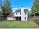 Home's rear elevation displaying a nice yard and porch at 145 Tara Way, Covington, GA 30016