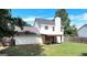 Spacious backyard with lush lawn, privacy fence, and covered patio at 145 Tara Way, Covington, GA 30016