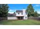 Large backyard featuring green grass, perimeter fencing and covered porch at 145 Tara Way, Covington, GA 30016