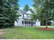 Beautiful two-story home with a covered front porch, a well-kept yard, and mature trees at 145 Tara Way, Covington, GA 30016
