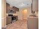 Updated kitchen boasting stainless steel appliances, granite countertops, and abundant storage at 145 Tara Way, Covington, GA 30016