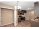 Kitchenette with modern appliances, granite countertops, and adjacent closet at 145 Tara Way, Covington, GA 30016