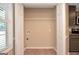 A utility room offers convenience with laundry hookups and shelf at 145 Tara Way, Covington, GA 30016
