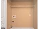 A functional utility room ready for laundry appliance hookups with a shelf at 145 Tara Way, Covington, GA 30016