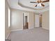 Main bedroom with carpeted floors, ceiling fan and access to the en suite bathroom at 145 Tara Way, Covington, GA 30016