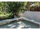 Inviting back deck area perfect for lounging in a tranquil, private space surrounded by trees at 32 Highland Ne Dr, Atlanta, GA 30305