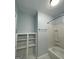 Bathroom featuring a bathtub, built-in shelves, and white trim at 32 Highland Ne Dr, Atlanta, GA 30305