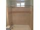 Bathroom showcasing a bathtub with shower and tile surround at 32 Highland Ne Dr, Atlanta, GA 30305