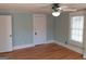 Bedroom with hardwood floors, a ceiling fan and neutral paint color at 32 Highland Ne Dr, Atlanta, GA 30305