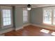 Bedroom with hardwood floors, neutral paint color, and bright sunlight through the windows at 32 Highland Ne Dr, Atlanta, GA 30305