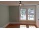 Bedroom with hardwood floors, neutral wall color, closet and a view of the backyard at 32 Highland Ne Dr, Atlanta, GA 30305