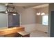 Bright dining room with elegant chandelier, chair rail, and tiled floor at 32 Highland Ne Dr, Atlanta, GA 30305