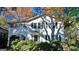 Charming two-story home with lush landscaping and mature trees creating a peaceful setting at 32 Highland Ne Dr, Atlanta, GA 30305