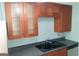 Kitchen featuring dark countertops and wood cabinets at 32 Highland Ne Dr, Atlanta, GA 30305
