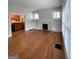 Spacious living room with hardwood floors, built-in shelves, and access to kitchen at 32 Highland Ne Dr, Atlanta, GA 30305